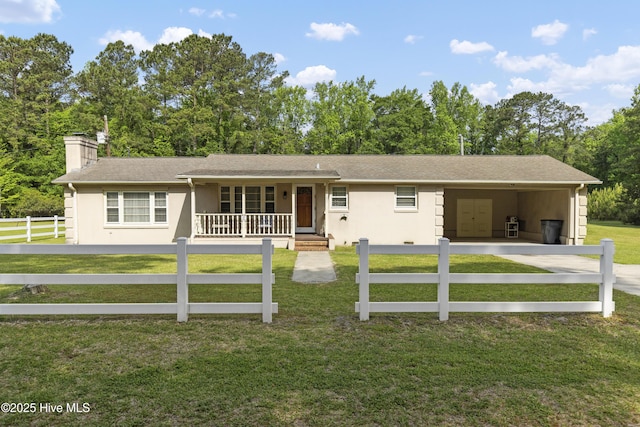 ranch-style house with a fenced front yard, an attached carport, a porch, a chimney, and concrete driveway