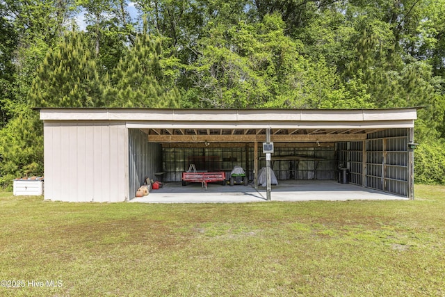 view of parking / parking lot with a pole building and a carport