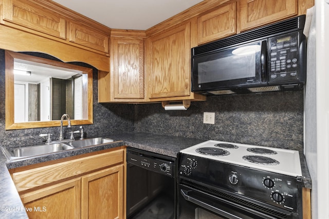 kitchen featuring a sink, dark countertops, decorative backsplash, and black appliances