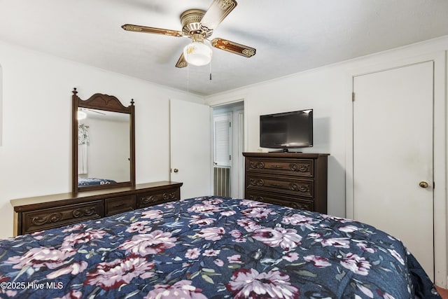bedroom with crown molding and a ceiling fan