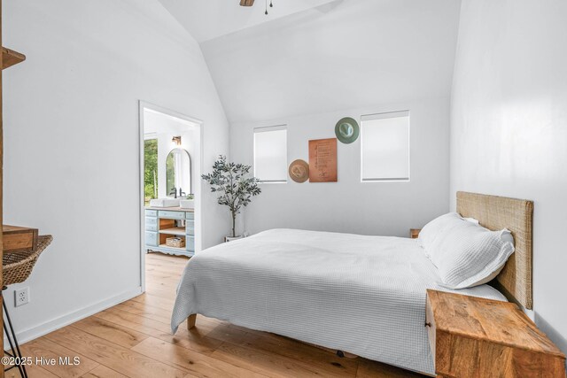 500 Tomahawk Rd, Maple Hill, NC 28454 - bedroom with vaulted ceiling, wood-type flooring, connected bathroom, and ceiling fan