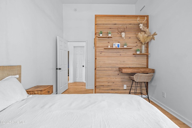 500 Tomahawk Rd, Maple Hill, NC 28454 - bedroom featuring wood finished floors, baseboards, and a closet