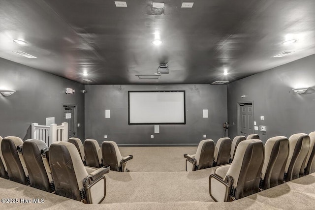 carpeted home theater room with visible vents