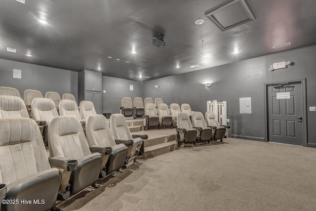 carpeted home theater room featuring baseboards and recessed lighting