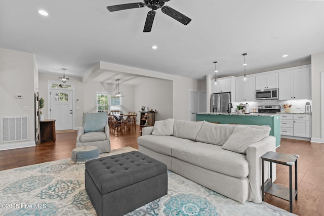 27 Pine Lake Dr, Whispering Pines, NC 28327 - living area with wood finished floors, ceiling fan, and recessed lighting
