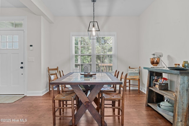 27 Pine Lake Dr, Whispering Pines, NC 28327 - dining space with wood finished floors, healthy amount of natural light, and baseboards