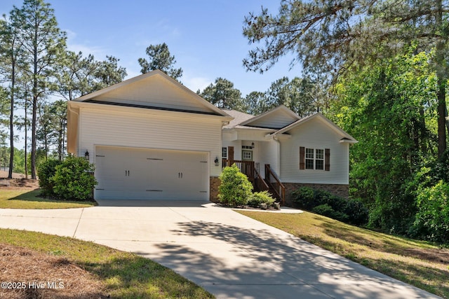 27 Pine Lake Dr, Whispering Pines, NC 28327 - ranch-style home with concrete driveway and an attached garage
