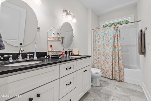 27 Pine Lake Dr, Whispering Pines, NC 28327 - full bathroom featuring toilet, double vanity, tile patterned flooring, and shower / tub combo with curtain