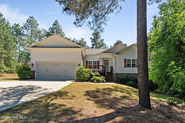 27 Pine Lake Dr, Whispering Pines, NC 28327 - single story home with a garage, driveway, and brick siding