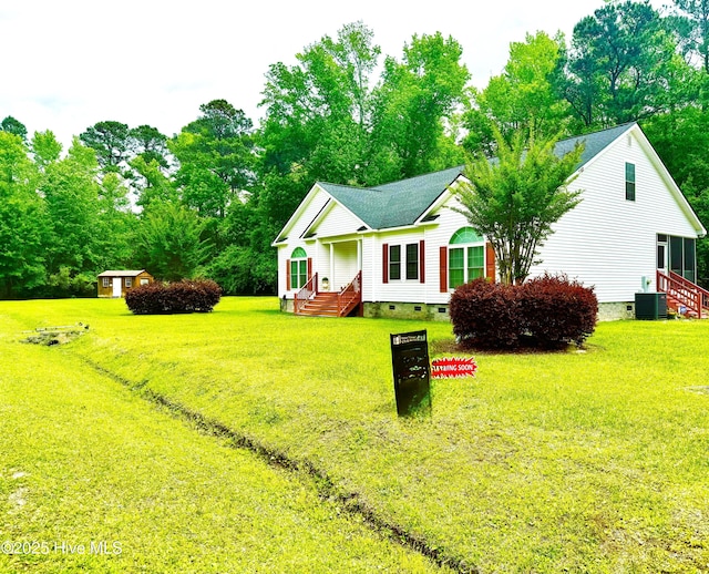 view of front of home with crawl space, a front yard, and roof with shingles