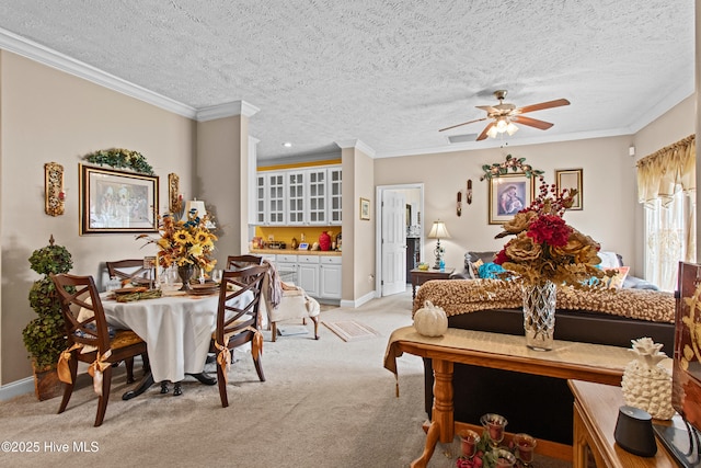 3332 Belt Rd, Castle Hayne, NC 28429 - dining area featuring light colored carpet, a textured ceiling, baseboards, ornamental molding, and ceiling fan