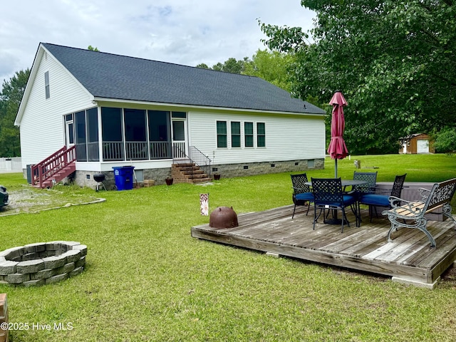 back of house featuring a sunroom, a fire pit, a deck, and crawl space