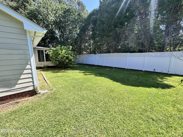 view of yard with a fenced backyard