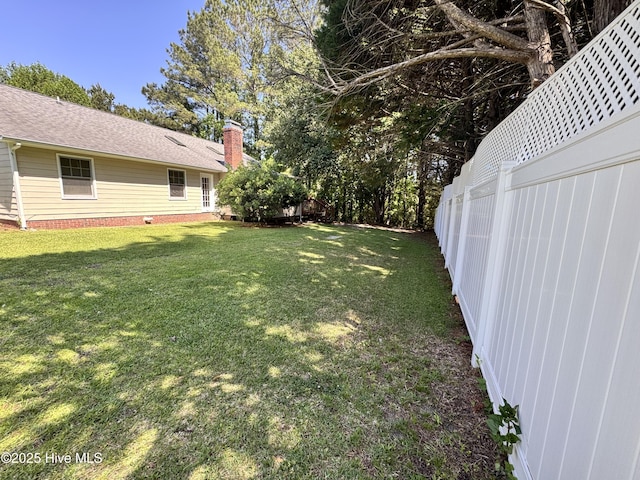 view of yard featuring fence