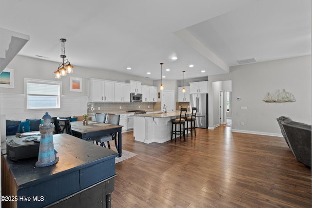 dining room featuring dark wood finished floors and recessed lighting