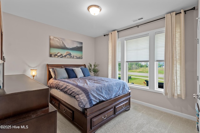 carpeted bedroom with baseboards