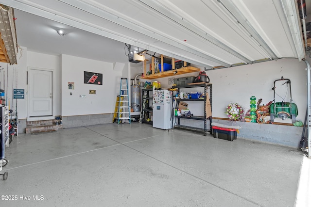 garage with a garage door opener and water heater