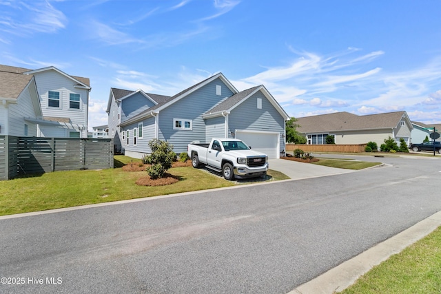 view of asphalt road with a residential view