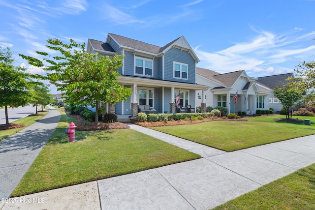 view of front of property featuring a front lawn and a porch