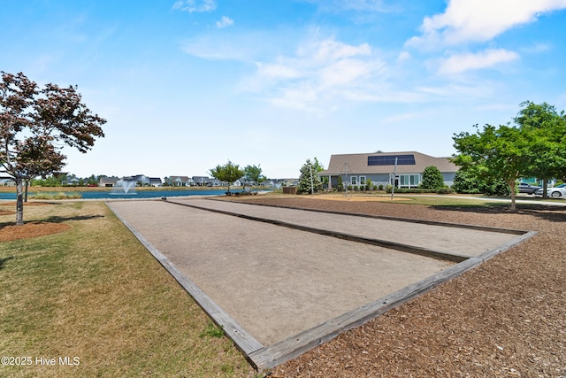 surrounding community with a game area and a yard
