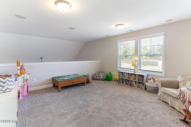 game room with carpet flooring, lofted ceiling, and visible vents