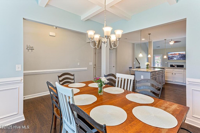 dining area featuring dark wood-style flooring, beamed ceiling, an inviting chandelier, and stairway
