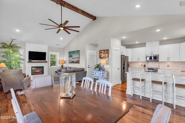 dining room with recessed lighting, a glass covered fireplace, and ceiling fan