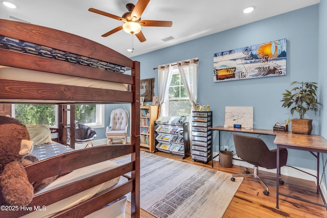 bedroom with ceiling fan, recessed lighting, wood finished floors, and visible vents