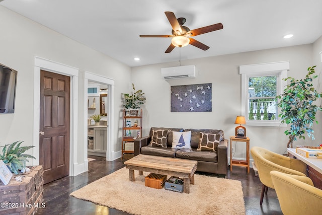 living room featuring baseboards, a ceiling fan, an AC wall unit, and recessed lighting