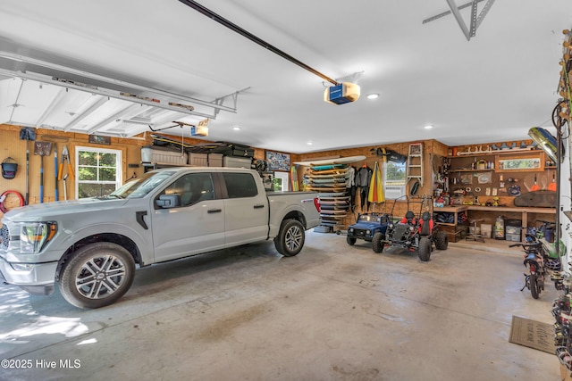 garage featuring a workshop area and a garage door opener
