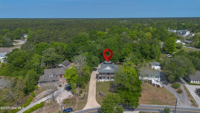bird's eye view featuring a forest view