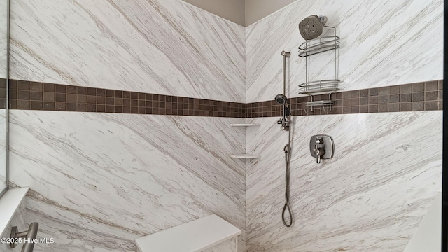 room details featuring a tile shower
