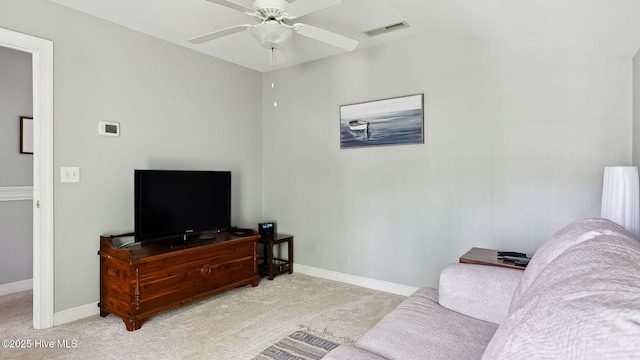 carpeted living room with baseboards, ceiling fan, vaulted ceiling, and visible vents