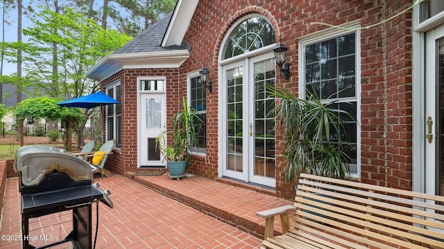 view of patio / terrace with french doors and a grill