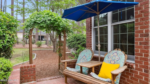 view of patio featuring fence