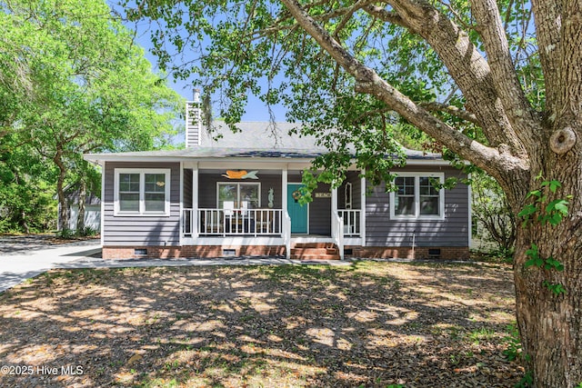 116 SE 20th St, Oak Island, NC 28465 - single story home featuring a chimney, covered porch, and crawl space