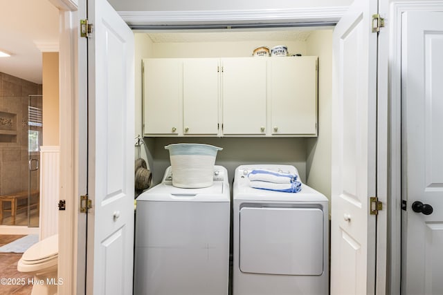 116 SE 20th St, Oak Island, NC 28465 - laundry room with cabinet space and washer and clothes dryer