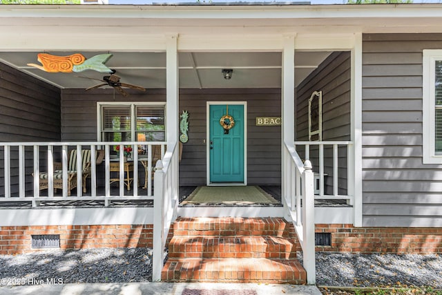 116 SE 20th St, Oak Island, NC 28465 - property entrance with a porch, a ceiling fan, and crawl space