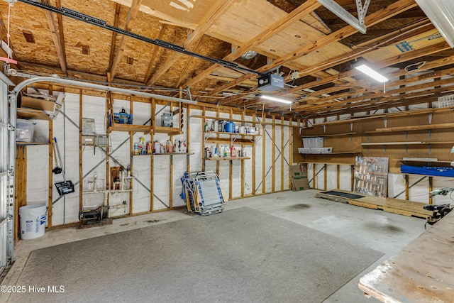 116 SE 20th St, Oak Island, NC 28465 - garage featuring a garage door opener and a workshop area