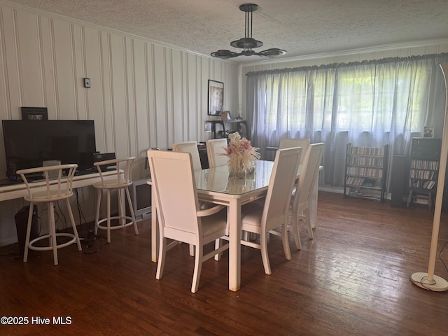 212 S Spence Ave, Goldsboro, NC 27534 - dining area with ornamental molding, a textured ceiling, wood finished floors, and a ceiling fan