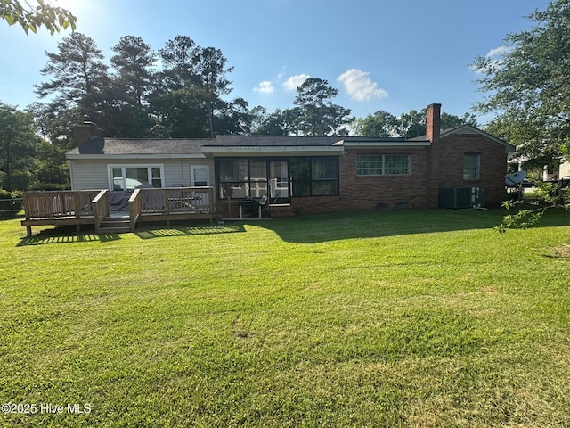 212 S Spence Ave, Goldsboro, NC 27534 - back of house featuring a chimney, central AC unit, a wooden deck, and a yard