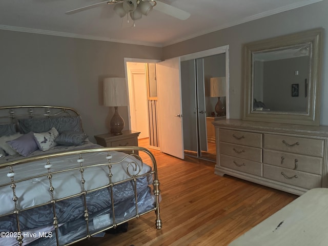 212 S Spence Ave, Goldsboro, NC 27534 - bedroom with wood finished floors, ornamental molding, a closet, and ceiling fan