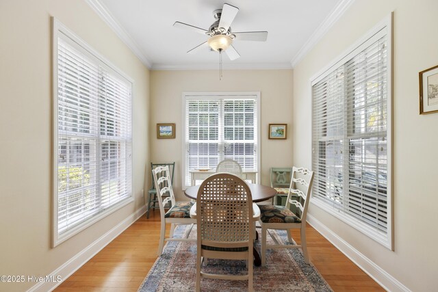 3733 Winstead Cir, Southport, NC 28461 - dining space featuring crown molding, baseboards, ceiling fan, and light wood-type flooring