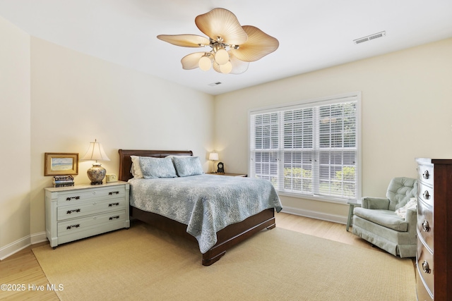 3733 Winstead Cir, Southport, NC 28461 - bedroom with baseboards, ceiling fan, light wood-style flooring, and visible vents