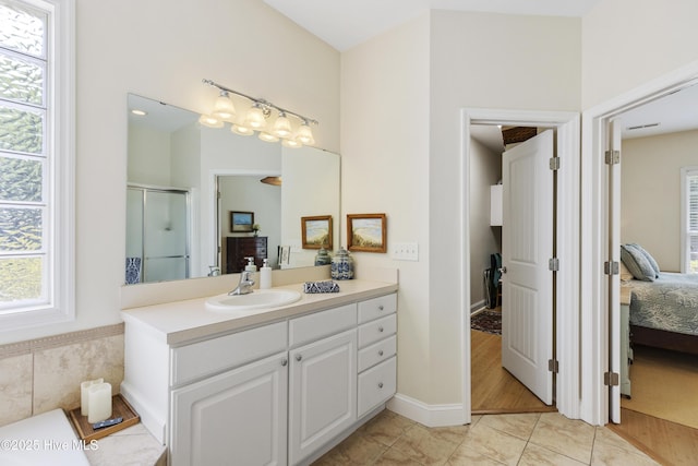 3733 Winstead Cir, Southport, NC 28461 - full bath with an enclosed shower, vanity, tile patterned flooring, and ensuite bath