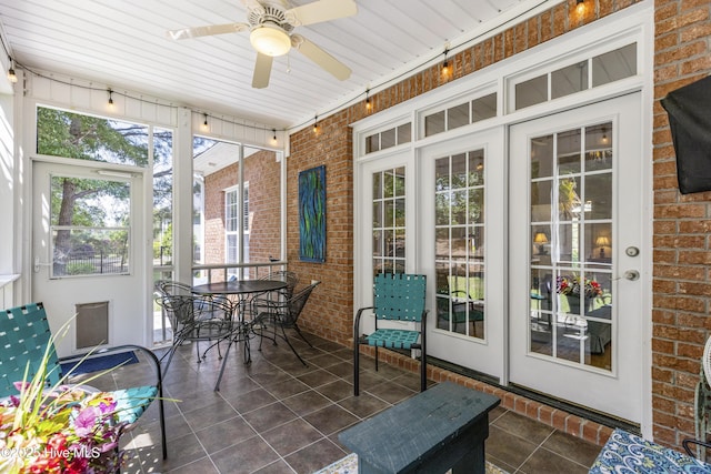 3733 Winstead Cir, Southport, NC 28461 - sunroom / solarium featuring a ceiling fan and outdoor dining space