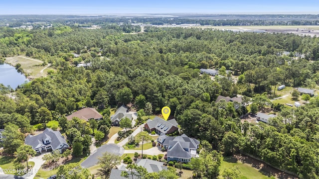 3733 Winstead Cir, Southport, NC 28461 - birds eye view of property with a residential view and a wooded view