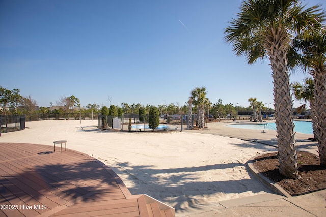 3733 Winstead Cir, Southport, NC 28461 - view of yard with a community pool and fence