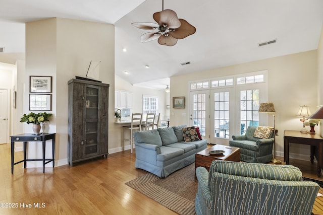 3733 Winstead Cir, Southport, NC 28461 - living room featuring a ceiling fan, visible vents, a wealth of natural light, and light wood-style floors