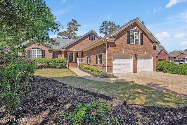 600 Sea Castle Ct, Wilmington, NC 28412 - view of front facade featuring a front yard, an attached garage, brick siding, and driveway